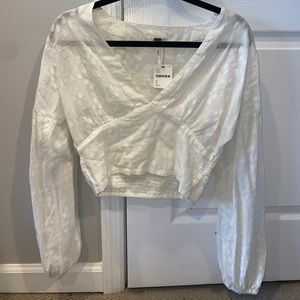Small Free People top! Never worn tags still on